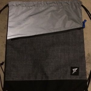 Reflective pull string bag